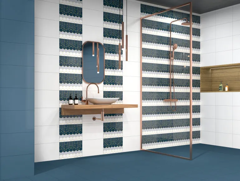 Trendy blue bathroom design featuring a contemporary sink, mirror and shower area